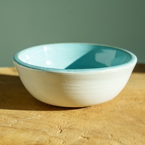 Blue and white ceramic bowl. Blue bowl made from handcrafted pottery.
