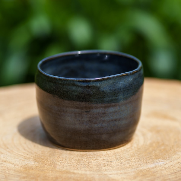 Small decorative blue gray ceramic pot in stoneware. Sky blue and black stoneware ceramic candle pot. Sandstone pottery candle container.