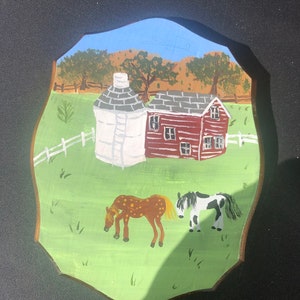 The Horses Are Grazing on a Quite Summers Day