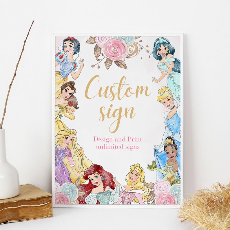 May include: A white framed poster with a pink and gold floral design. The poster features illustrations of Disney princesses, including Snow White, Belle, Ariel, Cinderella, Jasmine, and Tiana. The text "Custom sign" and "Design and Print unlimited signs" is printed on the poster.