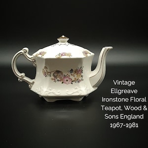 May include: Vintage Ellgreave Ironstone Floral Teapot, Wood & Sons England 1967-1981. White teapot with a floral design and gold accents.