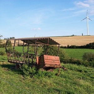 Nature image with hay cart and windmill