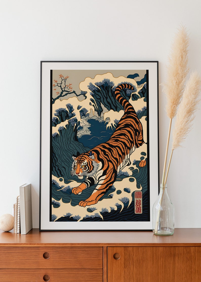 May include: A framed print of a tiger emerging from a wave, inspired by traditional Japanese woodblock prints. The tiger is orange and black with white stripes, and the wave is blue and white. The print is set against a beige background and includes the Japanese characters "龍虎" (Ryuko) which means "Dragon Tiger".
