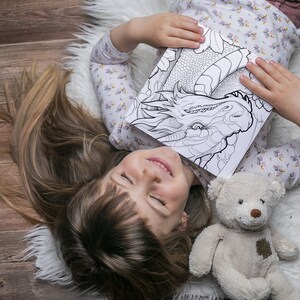 This grayscale Dragon Coloring Book features 30 detailed pages for kids and adults to enjoy. Delivered as an instantly downloadable printable coloring PDF, it is ideal for fantasy coloring lovers, especially fans of House of the Dragon and Dungeons and Dragons. Perfect for adults dragon fans and kids dragon pages alike, it includes dragon art, DND coloring themes, fantasy dragon art, mythical creatures, and offers a relaxing detailed coloring experience. This dragon coloring PDF.
