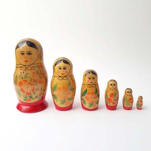 Vintage FOLK ART USSR Matryoshka Folklore Wooden Figurine Hand Painted Floral Russian Folk Art Set of 6 Nesting Dolls Red