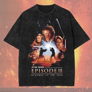 May include: Black oversized premium tee with a Star Wars Episode III: Revenge of the Sith graphic. The design includes character portraits and action scenes. The shirt has the text "Premium Wash: Black", "Oversized Premium Tee!" and "Original Artist of This Design".