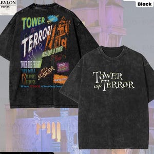 Op de afbeelding: Zwart oversized t-shirt met de tekst "Tower of Terror" op de voor- en achterkant. De achterkant heeft kleurrijke graphics en tekst, waaronder "Hollywood Tower", "Twice the Fright" en "It's a Scream!"
