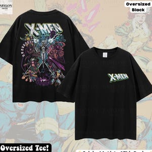 May include: An oversized black t-shirt featuring a large, colorful graphic on the back depicting various X-Men characters and the text X-MEN. The front of the shirt displays a smaller X-MEN logo on the left chest area. The shirt has short sleeves.