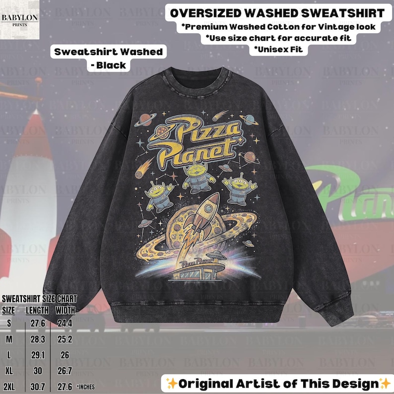 May include: Black oversized washed sweatshirt featuring a Pizza Planet graphic. The design includes the Pizza Planet logo, aliens, a rocket ship, and a planet with rings. The sweatshirt is made of premium washed cotton for a vintage look. Unisex fit.