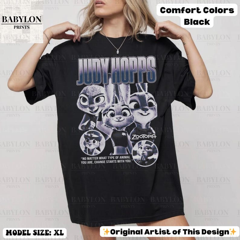 May include: Black t-shirt featuring Judy Hopps from Zootopia. The design includes multiple images of the character and the text "JUDY HOPPS" in a blue gradient. The shirt also has the text "NO MATTER WHAT TYPE OF ANIMAL YOU ARE, CHANGE STARTS WITH YOU."