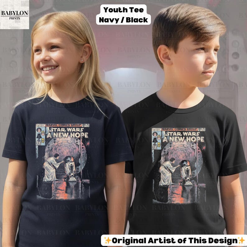 May include: Two youth t-shirts, one navy and one black, each featuring a Star Wars comic book cover design. The graphic includes the text "STAR WARS A NEW HOPE" and illustrations of characters. The shirts are labeled "Youth Tee Navy/Black."