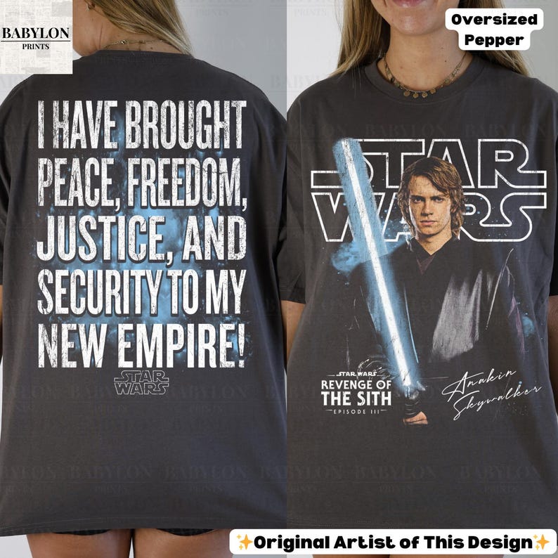 May include: Dark gray oversized t-shirt featuring text from Star Wars. The front displays Anakin Skywalker with a lightsaber and the text "STAR WARS REVENGE OF THE SITH". The back has the quote "I HAVE BROUGHT PEACE, FREEDOM, JUSTICE, AND SECURITY TO MY NEW EMPIRE!"