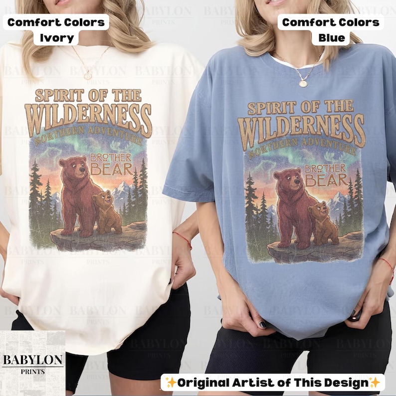 May include: Ivory and blue comfort colour t-shirts with a graphic featuring a bear and cub with the text "Spirit of the Wilderness" and "Brother Bear". The design includes a mountain and forest scene.