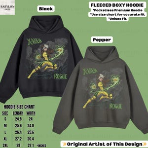 May include: Black and pepper-coloured fleeced boxy hoodies featuring a Rogue graphic from X-Men. The hoodies have a pocketless design and are available in unisex sizes. The size chart shows lengths from 63 to 71 cm.