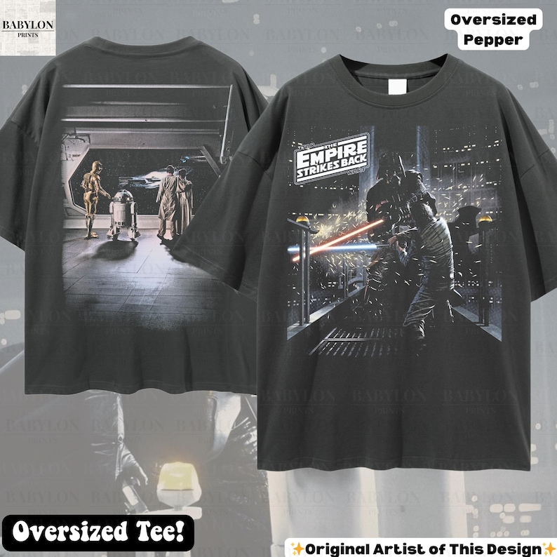 May include: Dark gray oversized tee featuring Star Wars imagery. The front displays a scene from "The Empire Strikes Back" with Darth Vader. The back shows C-3PO, R2-D2, and other characters. The shirt has the text "Oversized Pepper" and "Oversized Tee!"