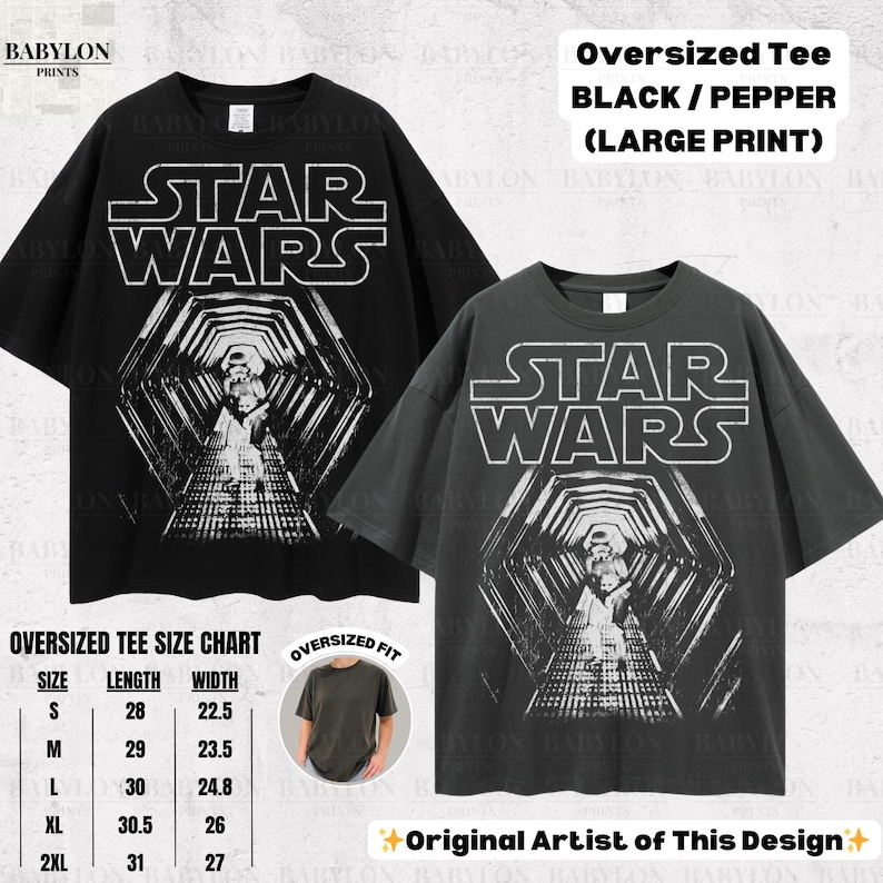 May include: Two oversized black and pepper-colored Star Wars graphic tees. The shirts feature a large print of the Star Wars logo and a tunnel scene. The size chart shows measurements in inches. The text "Original Artist of This Design" is also visible.