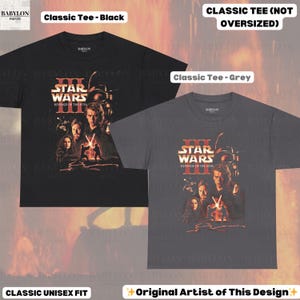 May include: Two classic unisex fit t-shirts, one black and one grey, featuring a Star Wars: Revenge of the Sith graphic. The design includes characters and the film's title in red and white. The shirts are labeled "Classic Tee".