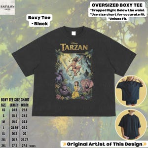 May include: Black boxy tee featuring a Disney Tarzan graphic. The shirt has a crew neck and short sleeves. The graphic includes Tarzan, Jane, gorillas, and an elephant. The shirt is available in sizes XS to 3XL. The text "OVERSIZED BOXY TEE" is also visible.