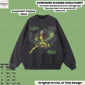 May include: Black oversized washed sweatshirt with a graphic of Rogue from X-Men. The design includes the text "X-Men" and "Rogue". The sweatshirt has a vintage look and is made of premium washed cotton. A size chart is included.
