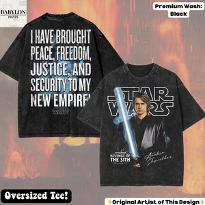 May include: Black oversized Star Wars t-shirt featuring Anakin Skywalker with a lightsaber. The front of the shirt has the Star Wars logo and text from the movie. The back of the shirt has the text "I HAVE BROUGHT PEACE, FREEDOM, JUSTICE, AND SECURITY TO MY NEW EMPIRE".