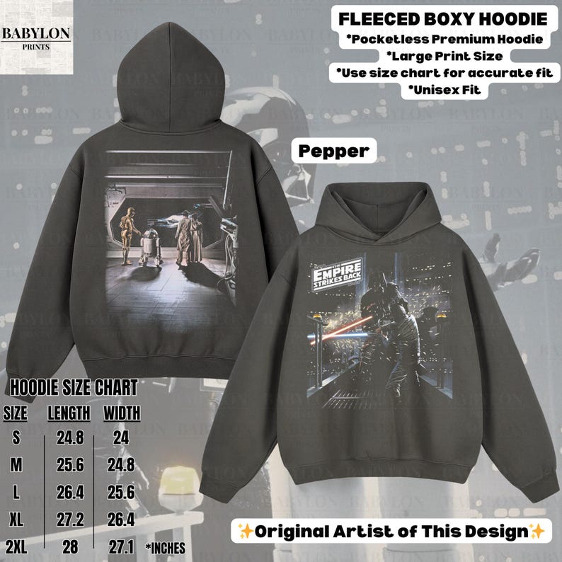 May include: A dark gray fleece boxy hoodie with a Star Wars graphic on the front and back. The front features a scene from the movie, and the back displays Darth Vader. The hoodie has a hood and is available in sizes S to 2XL.