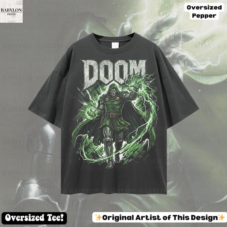 May include: Dark gray oversized t-shirt featuring a graphic of a character with the word "DOOM" in a distressed font. The character is in green and black with green lightning. The shirt has the text "Oversized Tee!" and "Original Artist of This Design".