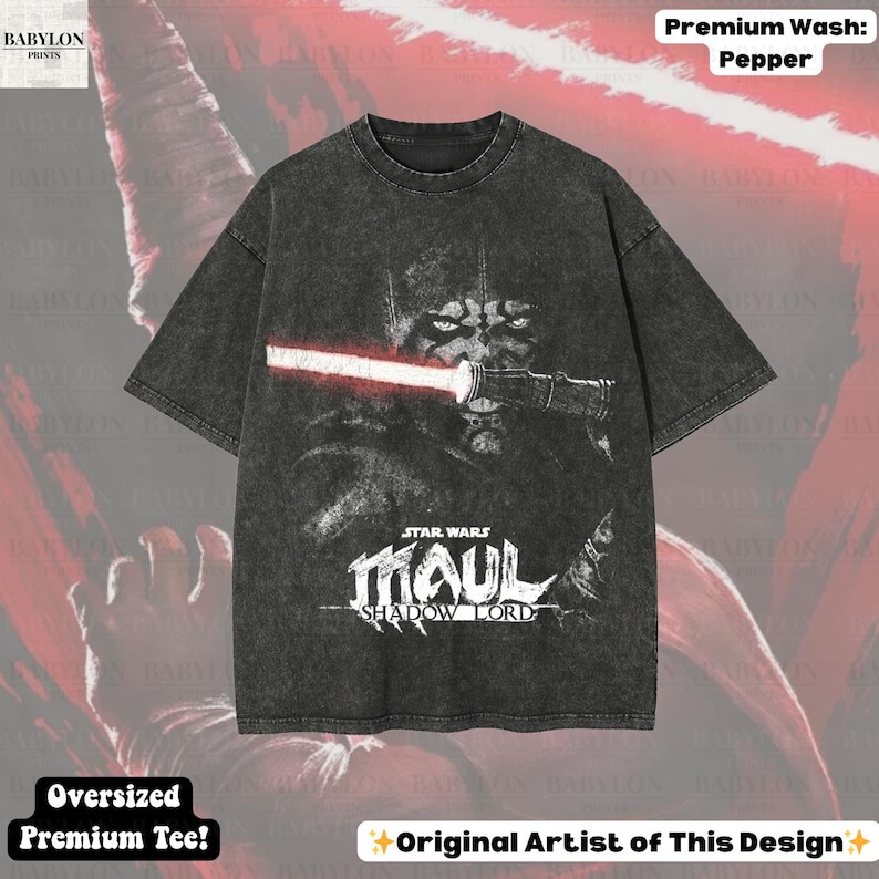 May include: A dark gray oversized premium tee featuring a Star Wars graphic. The design includes the text "STAR WARS MAUL SHADOW LORD" and an image of Darth Maul with a red lightsaber. The shirt is labeled "Premium Wash: Pepper".