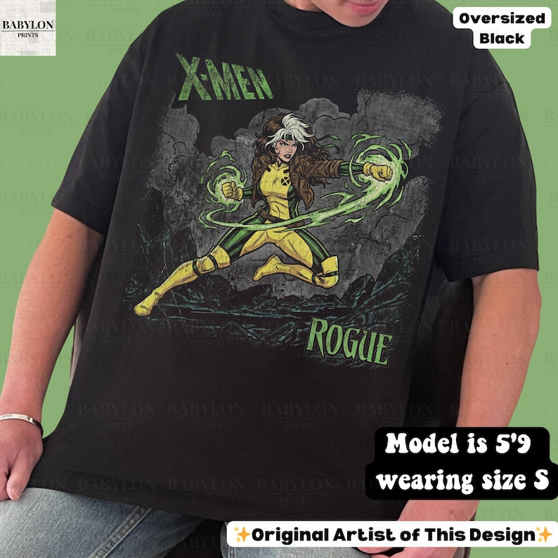 May include: Black oversized t-shirt with a graphic of the X-Men character Rogue in yellow and green, with the text "X-MEN" and "ROGUE" in green. The shirt is a size S.