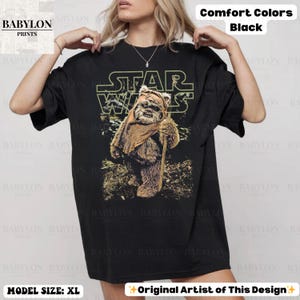 May include: A handmade wooden sign with the text "Welcome" in a playful font. The sign is painted white with a distressed finish, and features a decorative floral design in shades of pink and green. It measures approximately 12 inches wide.