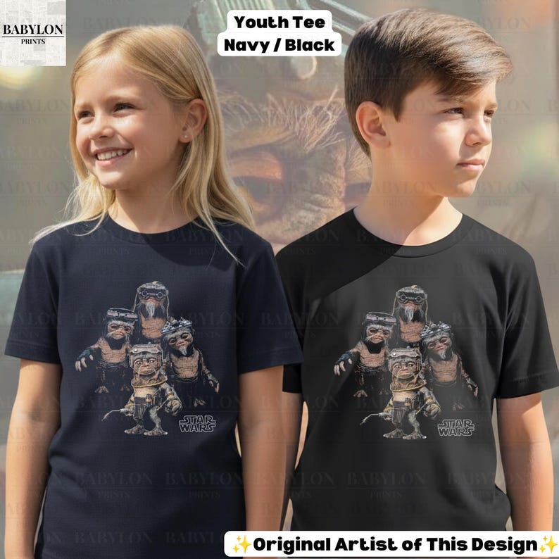 May include: A navy blue and a black short-sleeve t-shirt, each featuring a graphic print of four Ewok characters from Star Wars. The design includes the Star Wars logo in the bottom right corner of the graphic. The shirts have a crew neckline.