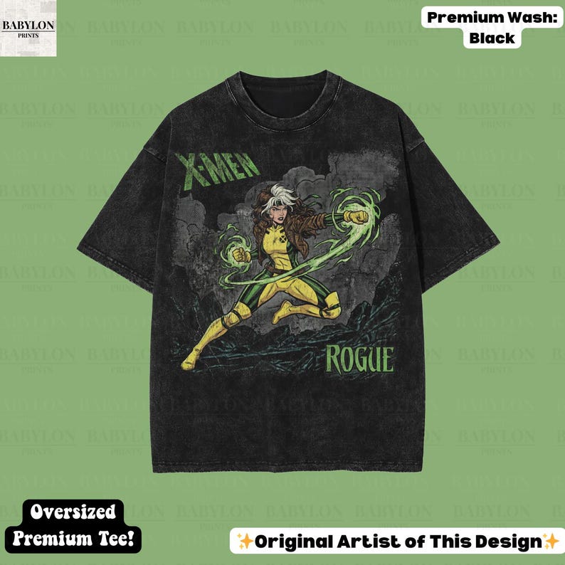 May include: Black oversized premium tee with a Rogue graphic from X-Men. The design includes the text "X-MEN" and "ROGUE" in green. The character is shown in a yellow and green costume, with energy effects.