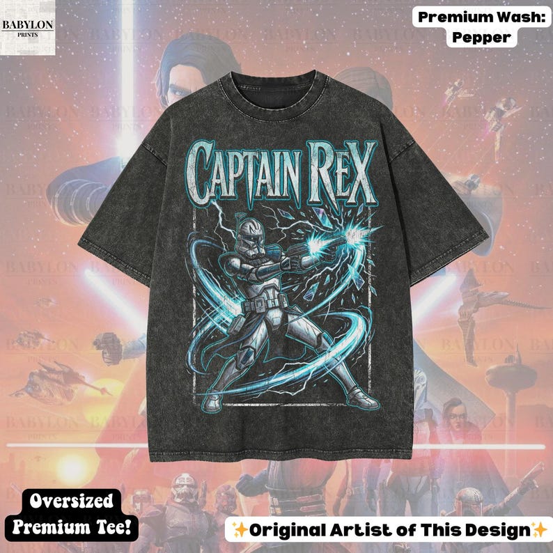 May include: Dark grey oversized t-shirt featuring a graphic of Captain Rex, a Star Wars character, with the text "CAPTAIN REX". The shirt also has the text "Oversized Premium Tee!" and "Original Artist of This Design".