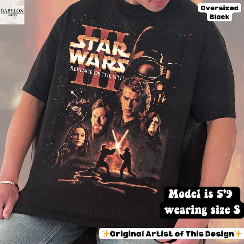 May include: Black oversized t-shirt featuring a Star Wars: Revenge of the Sith graphic. The design includes characters and the film's title in orange and white. The shirt is a size S and the model is 5'9.