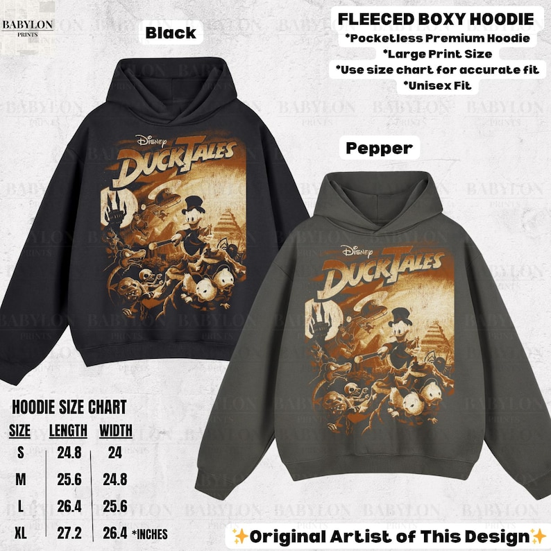 May include: Black and pepper-colored fleece boxy hoodies featuring a Disney DuckTales graphic. The hoodies have a large print size and are unisex fit. The size chart shows measurements in inches. The design is by the original artist.