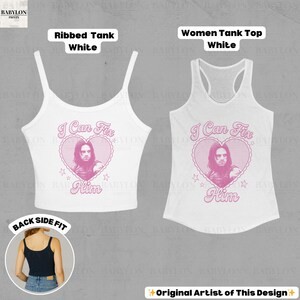 May include: Two white tank tops with the text "I Can Fix Him" in pink, featuring a heart and a portrait. One is a ribbed tank, the other a women's tank top. The image also shows a black tank top.