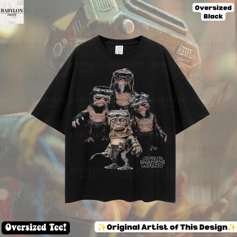 May include: An oversized black t-shirt featuring a graphic print of four Ewok characters from Star Wars. The characters are depicted in a group, with one standing in the foreground holding a tool. The Star Wars logo is printed in white at the bottom right.