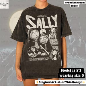 May include: Black t-shirt featuring a graphic of Sally from "The Nightmare Before Christmas." The design includes the character's name and a quote. The shirt is a premium wash and the model is 5'7" wearing size S. Original artist design.