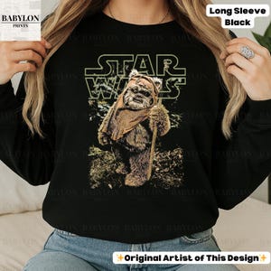 May include: A handmade wooden sign with the text "Welcome" in a playful font. The sign is painted white with a distressed finish, and features a decorative floral design in shades of pink and green. It is designed for indoor or outdoor use.