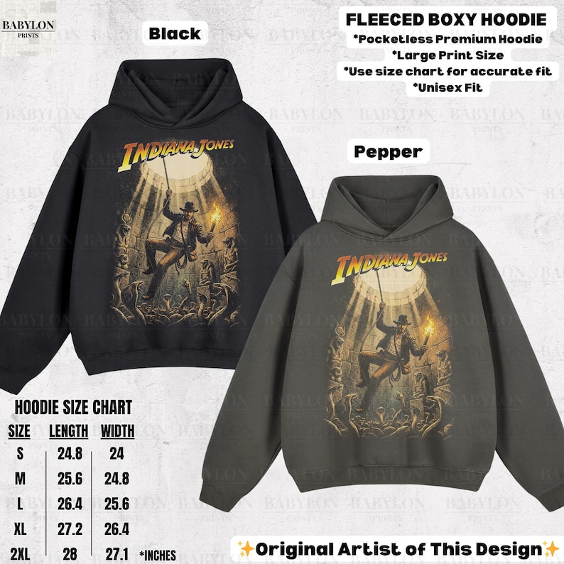 May include: Black and pepper-colored fleeced boxy hoodies featuring the Indiana Jones logo and graphic. The hoodies have a large print size and are unisex fit. A size chart is included. The design is by the original artist.