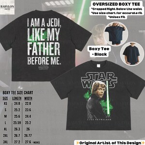 May include: Black oversized boxy tee featuring a Star Wars design. The front of the shirt displays Luke Skywalker with a lightsaber, while the back reads "I AM A JEDI, LIKE MY FATHER BEFORE ME." Includes a size chart in inches. Unisex fit.