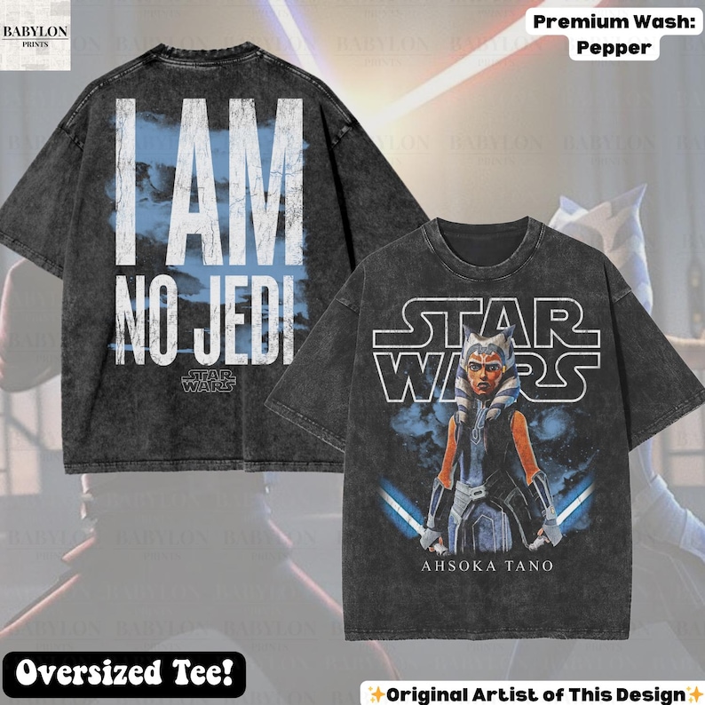 May include: Two oversized black t-shirts. One features the text "I AM NO JEDI" with a blue cloud background and the Star Wars logo. The other shirt displays Ahsoka Tano with lightsabers and the Star Wars logo. The shirts are a pepper wash.