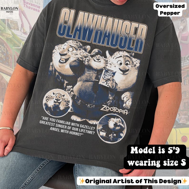 May include: Dark gray oversized t-shirt featuring a graphic of Clawhauser from the movie Zootopia. The design includes the text "CLAWHAUSER" and quotes. The shirt is a size S and the model is 5'9. Original artist design.