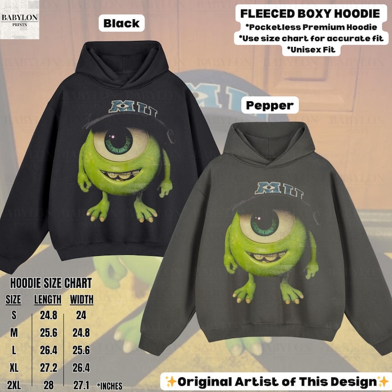 K&ouml;nnte beinhalten: Schwarze und pfefferfarbene Fleece-Boxy-Hoodies mit einer Cartoon-Figur mit einem Auge, die einen Hut tr&auml;gt. Die Hoodies haben den Text "MI" auf dem Hut. Das Bild enth&auml;lt eine Gr&ouml;&szlig;entabelle in Zoll und den Text "Original Artist of This Design".