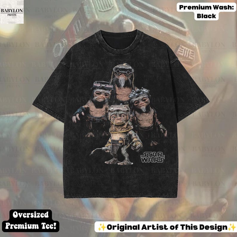 May include: A black, acid-washed, oversized short-sleeve t-shirt featuring a graphic print of four Ewok characters from Star Wars. The design includes the Star Wars logo in the bottom right corner. The shirt has a crew neckline and a relaxed fit.