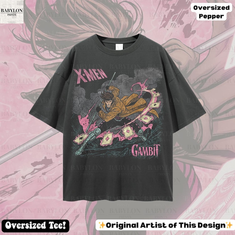 May include: Dark gray oversized t-shirt featuring a graphic of the X-Men character Gambit. The design includes the text "X-Men" and "Gambit" in a distressed style. The shirt also has the text "Oversized Tee!" and "Original Artist of This Design".