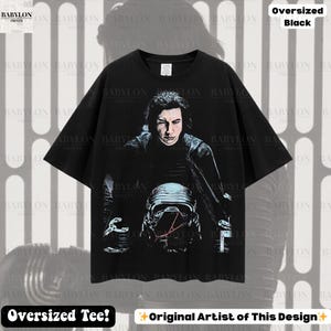 May include: Black oversized tee featuring a portrait of a character from a science fiction film. The graphic includes a helmet and the text "Oversized Black" and "Oversized Tee!"