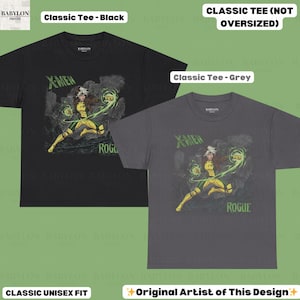 May include: Black and grey classic unisex fit t-shirts with a Rogue graphic from X-Men. The shirts display the text "X-Men" and "Rogue" in green. The design is by the original artist.