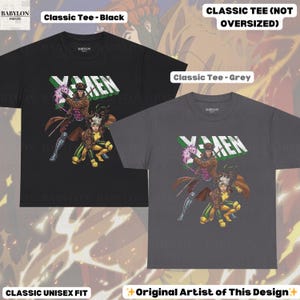 May include: Two classic unisex fit t-shirts, one black and one grey, featuring an X-Men graphic. The graphic includes the word "X-MEN" in white and green, and illustrations of Gambit and Rogue. The shirts are labeled "Classic Tee" and "Original Artist of This Design."
