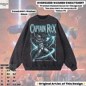 May include: Black oversized washed sweatshirt with a Captain Rex graphic and blue lightning. The text "CAPTAIN REX" is above the graphic. Made from premium washed cotton for a vintage look. Includes a size chart. Measurements in inches.