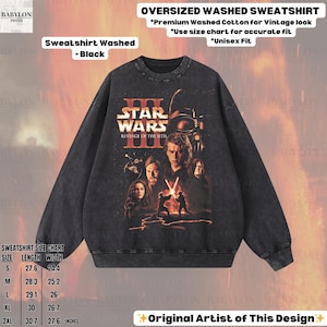 May include: Black oversized washed sweatshirt featuring a Star Wars: Revenge of the Sith graphic. The sweatshirt has a vintage look and is made of premium washed cotton. The size chart shows the length and width in inches.